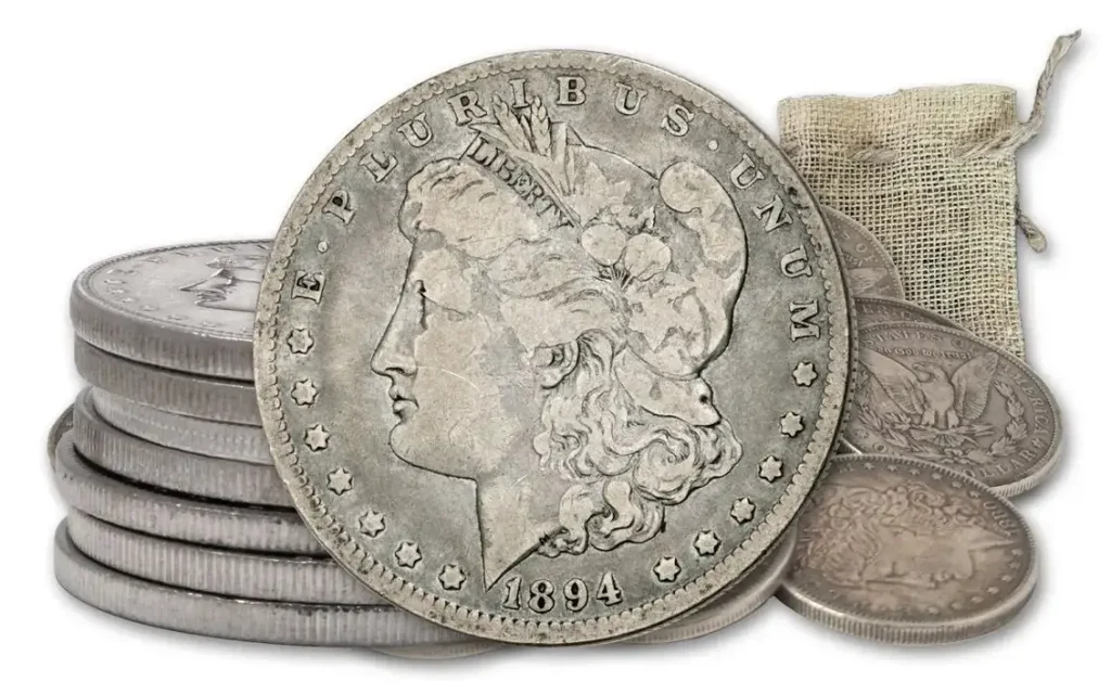 A picture of silver dollars arranged to showcase their detailed designs and luster.